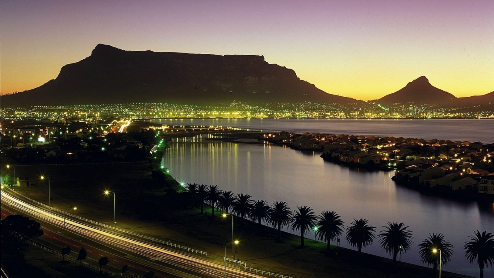 Cape Town and Table Mountain illuminated at dusk.